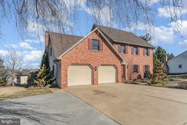 view of front of house featuring brick siding, a garage, driveway, and a shingled roof