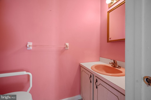 half bathroom featuring toilet and vanity