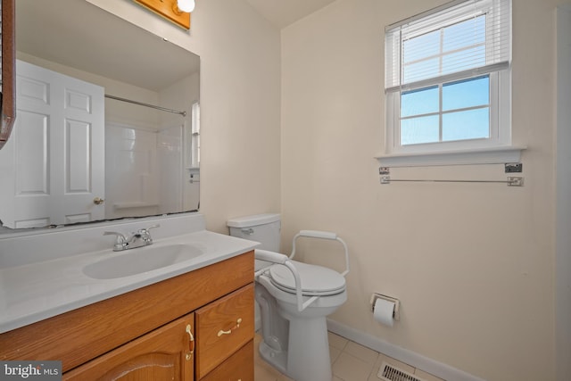 full bath with vanity, baseboards, a shower, tile patterned floors, and toilet