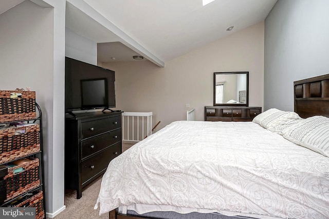 bedroom featuring light carpet and lofted ceiling