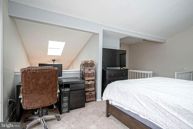 bedroom with carpet flooring and vaulted ceiling with skylight