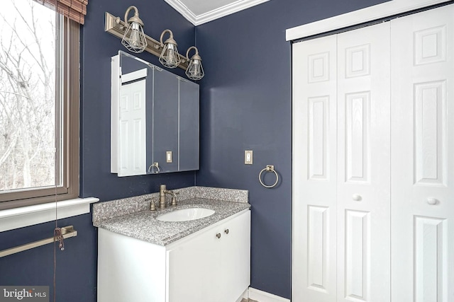 bathroom with vanity and crown molding