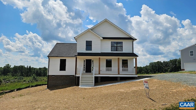 view of front of home with a porch, crawl space, and a shingled roof