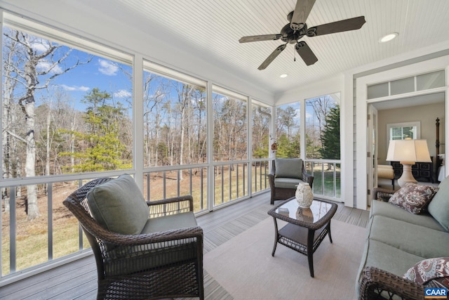 sunroom featuring ceiling fan