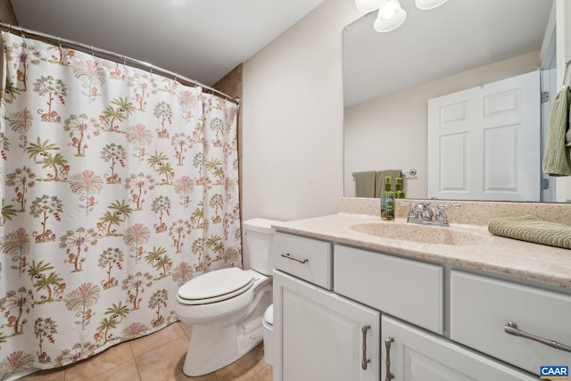 full bathroom featuring vanity, tile patterned floors, curtained shower, and toilet