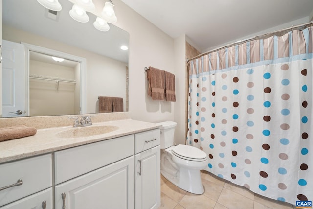 bathroom with visible vents, curtained shower, toilet, tile patterned floors, and vanity