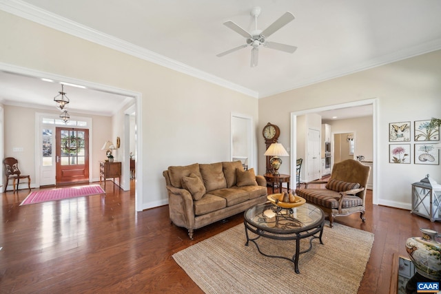 living room featuring ornamental molding, a ceiling fan, baseboards, and dark wood-style flooring