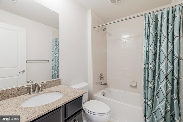 full bath with vanity, shower / tub combo, toilet, and visible vents