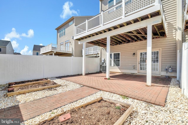 view of patio / terrace featuring central AC and fence