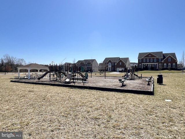 communal playground with a gazebo, a residential view, and a yard