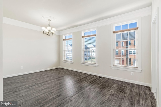 unfurnished room featuring visible vents, baseboards, dark wood-style flooring, ornamental molding, and a chandelier