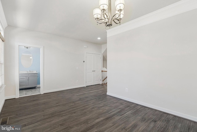 unfurnished dining area with dark wood-type flooring, baseboards, recessed lighting, a notable chandelier, and a sink