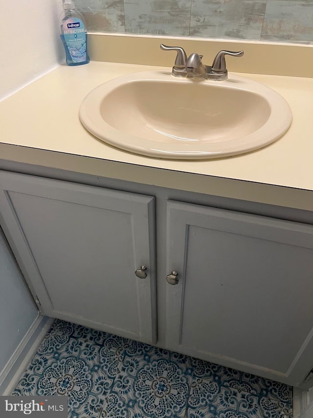 bathroom with vanity and tile patterned flooring