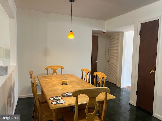 dining room featuring baseboards