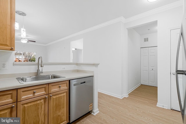 kitchen with a sink, light wood-style flooring, dishwasher, and ornamental molding