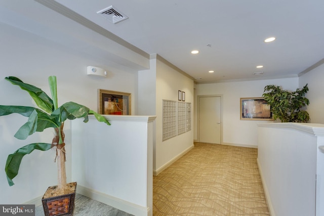 hallway with visible vents, baseboards, mail area, recessed lighting, and crown molding