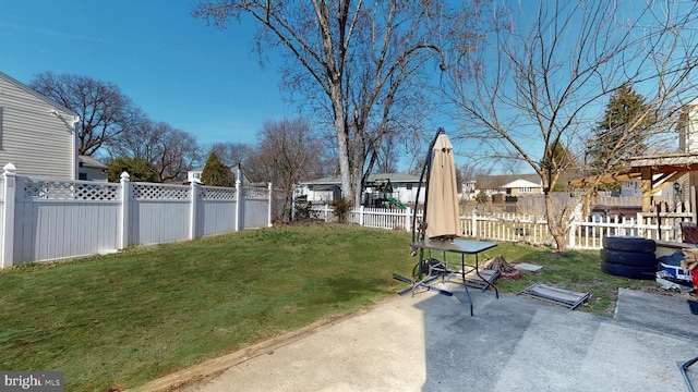 view of yard featuring a patio and a fenced backyard