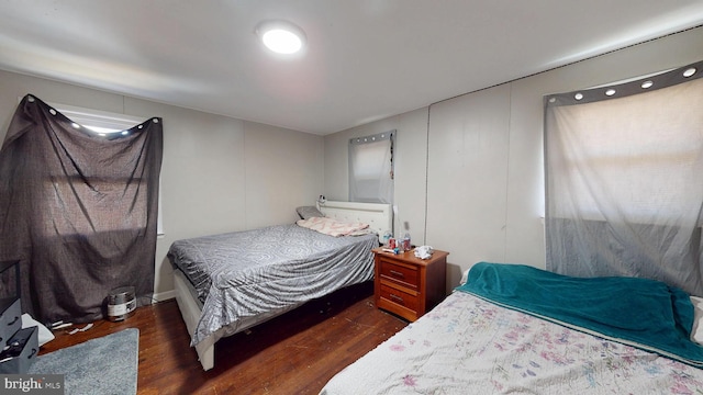 bedroom with wood finished floors