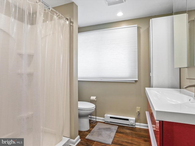 777 Timber Ln, Berkeley Springs, WV 25411 - full bathroom with visible vents, baseboard heating, wood finished floors, baseboards, and toilet