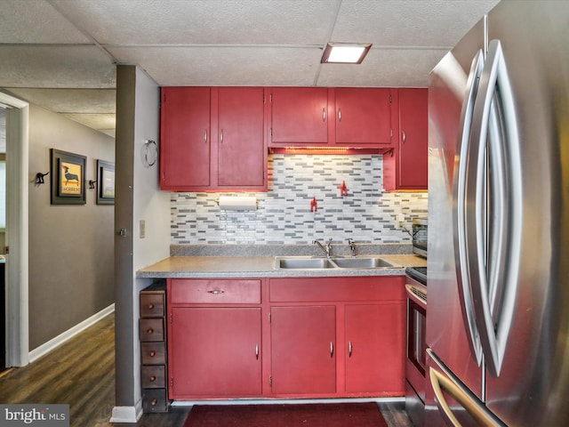 777 Timber Ln, Berkeley Springs, WV 25411 - kitchen featuring appliances with stainless steel finishes, a sink, tasteful backsplash, dark wood-style floors, and red cabinets