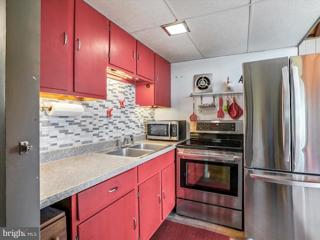 777 Timber Ln, Berkeley Springs, WV 25411 - kitchen featuring light countertops, stainless steel appliances, a sink, and red cabinets