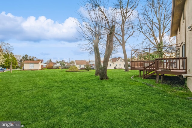 view of yard featuring a wooden deck