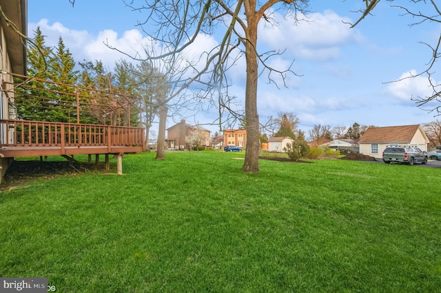 view of yard with a wooden deck