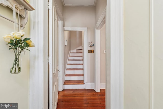 hall with dark wood-type flooring and stairway