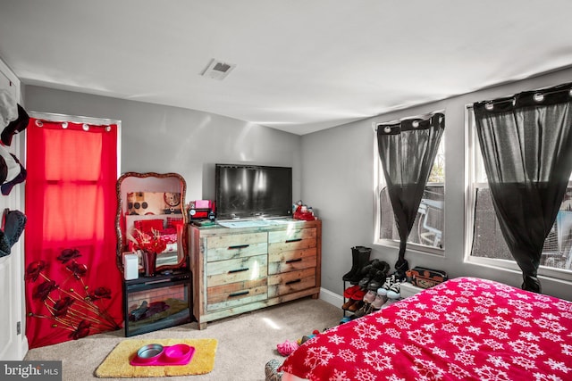 bedroom with visible vents, baseboards, and carpet floors