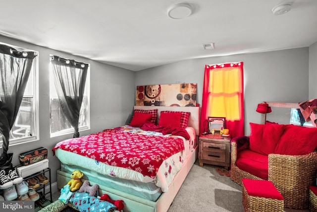 carpeted bedroom with visible vents