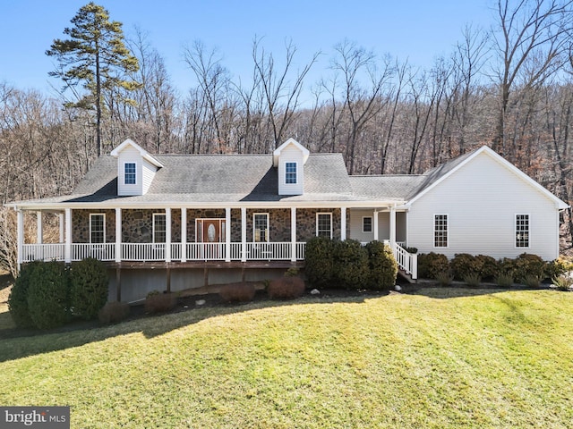 cape cod-style house featuring stone siding, a porch, a front lawn, and a shingled roof