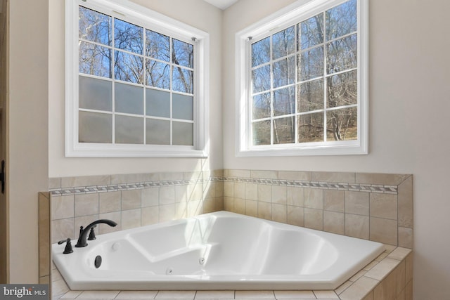 full bathroom with a whirlpool tub