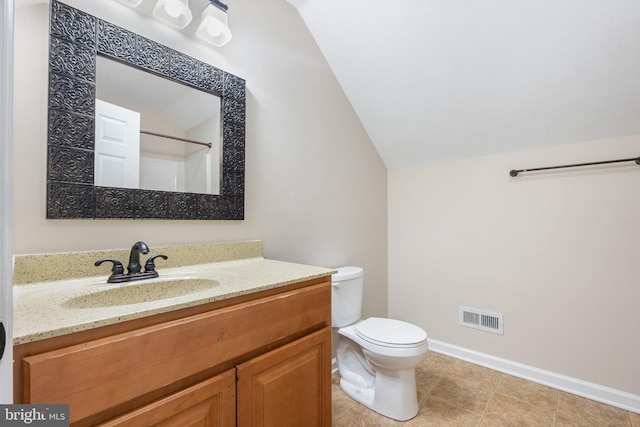 bathroom featuring visible vents, toilet, baseboards, vanity, and vaulted ceiling