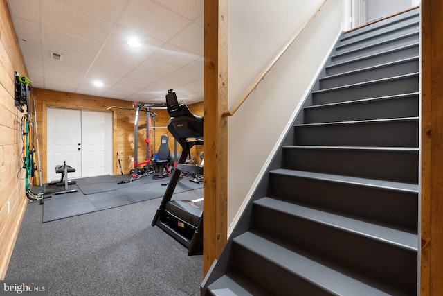 exercise area featuring visible vents, recessed lighting, and a paneled ceiling