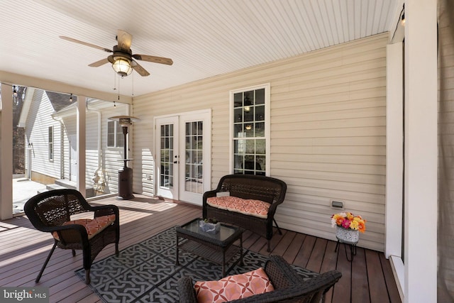 deck featuring french doors and a ceiling fan