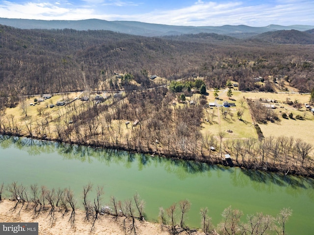 bird's eye view with a wooded view and a water and mountain view