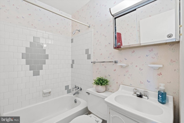 full bathroom featuring shower / bath combination, toilet, vanity, and wallpapered walls