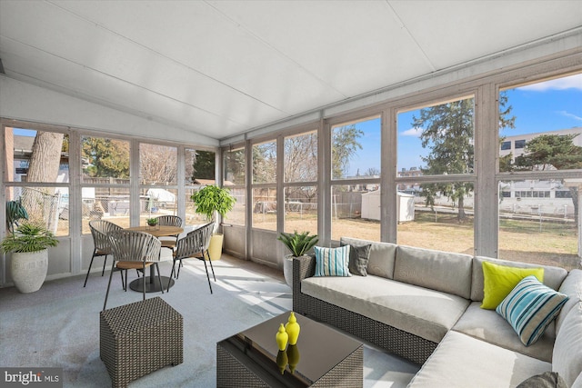 sunroom / solarium with lofted ceiling