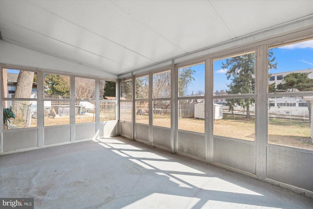 unfurnished sunroom with vaulted ceiling