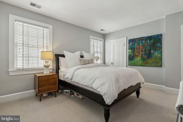 carpeted bedroom with baseboards