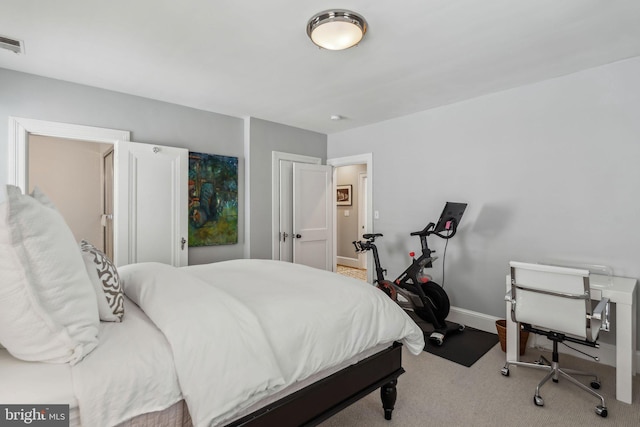 carpeted bedroom with baseboards