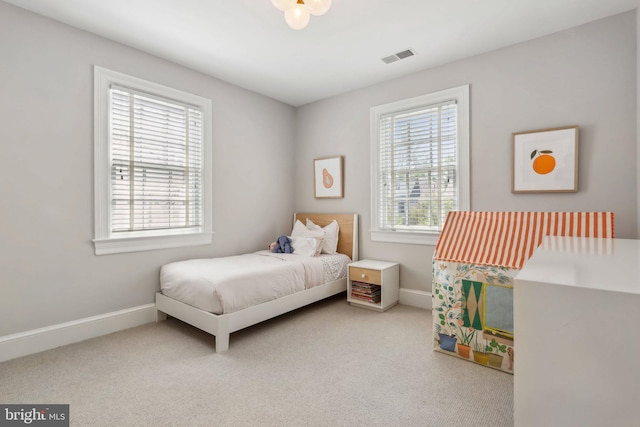 carpeted bedroom with baseboards