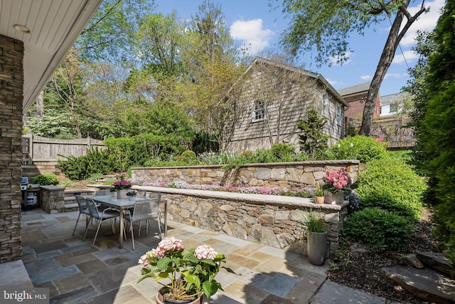 view of patio / terrace featuring fence and outdoor dining area