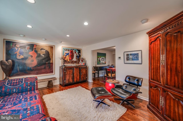 sitting room featuring recessed lighting, baseboards, and wood finished floors