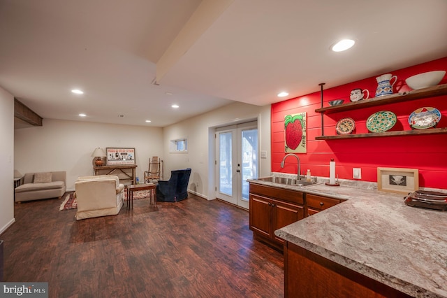 kitchen with dark wood finished floors, recessed lighting, french doors, and a sink