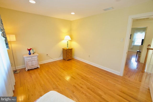 interior space with recessed lighting, baseboards, and light wood finished floors