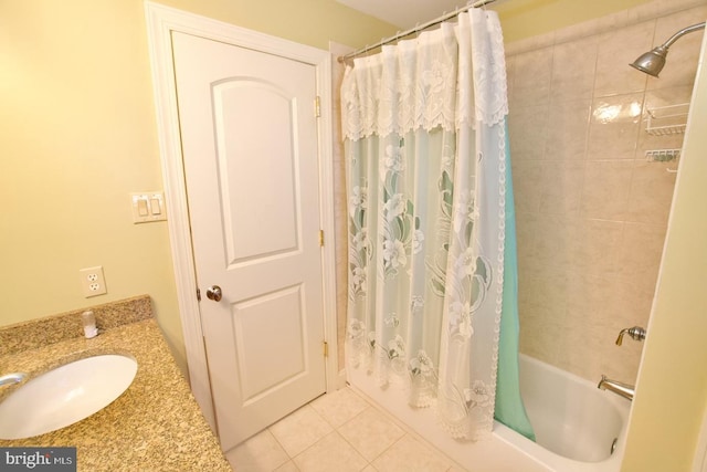 full bath featuring tile patterned flooring, shower / tub combo with curtain, and a sink