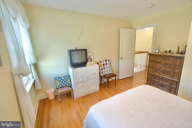 bedroom featuring wood finished floors