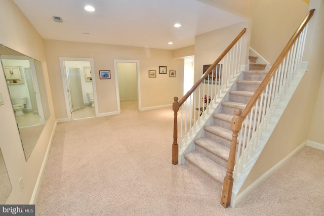 stairway with recessed lighting, carpet, visible vents, and baseboards