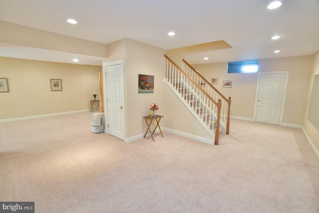 below grade area with recessed lighting, carpet, and baseboards